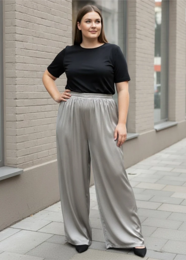 Spodnie damskie Ewelina, ujęcie z przodu, prezentujące elegancki charakter szerokich nogawek.