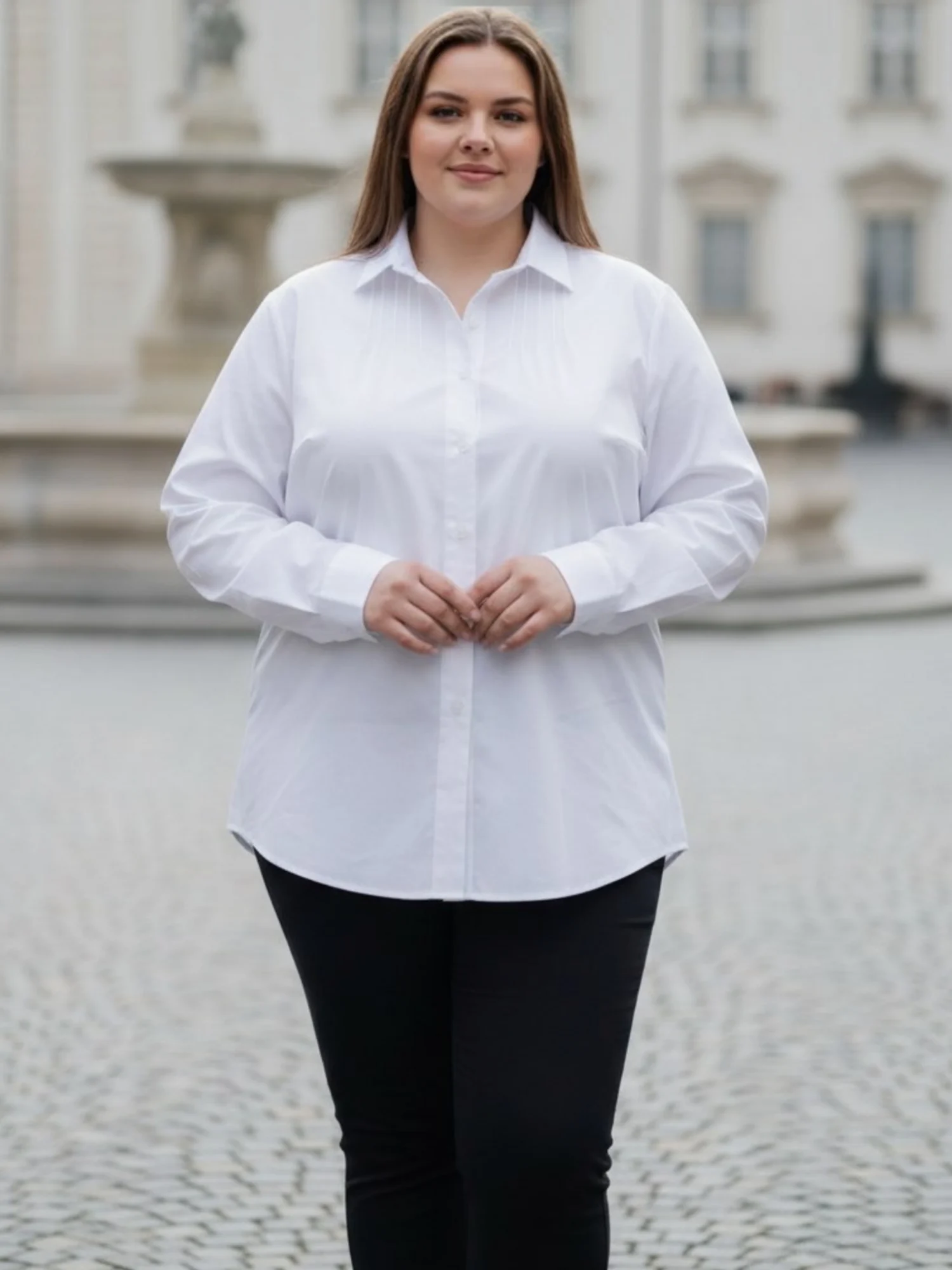 koszula_biala_waleria_plus_size_dlugi_rekaw_elegancka Koszula damska Waleria. Biała koszula w ujęciu frontalnym, prezentująca prosty fason i zaokrąglony dół.